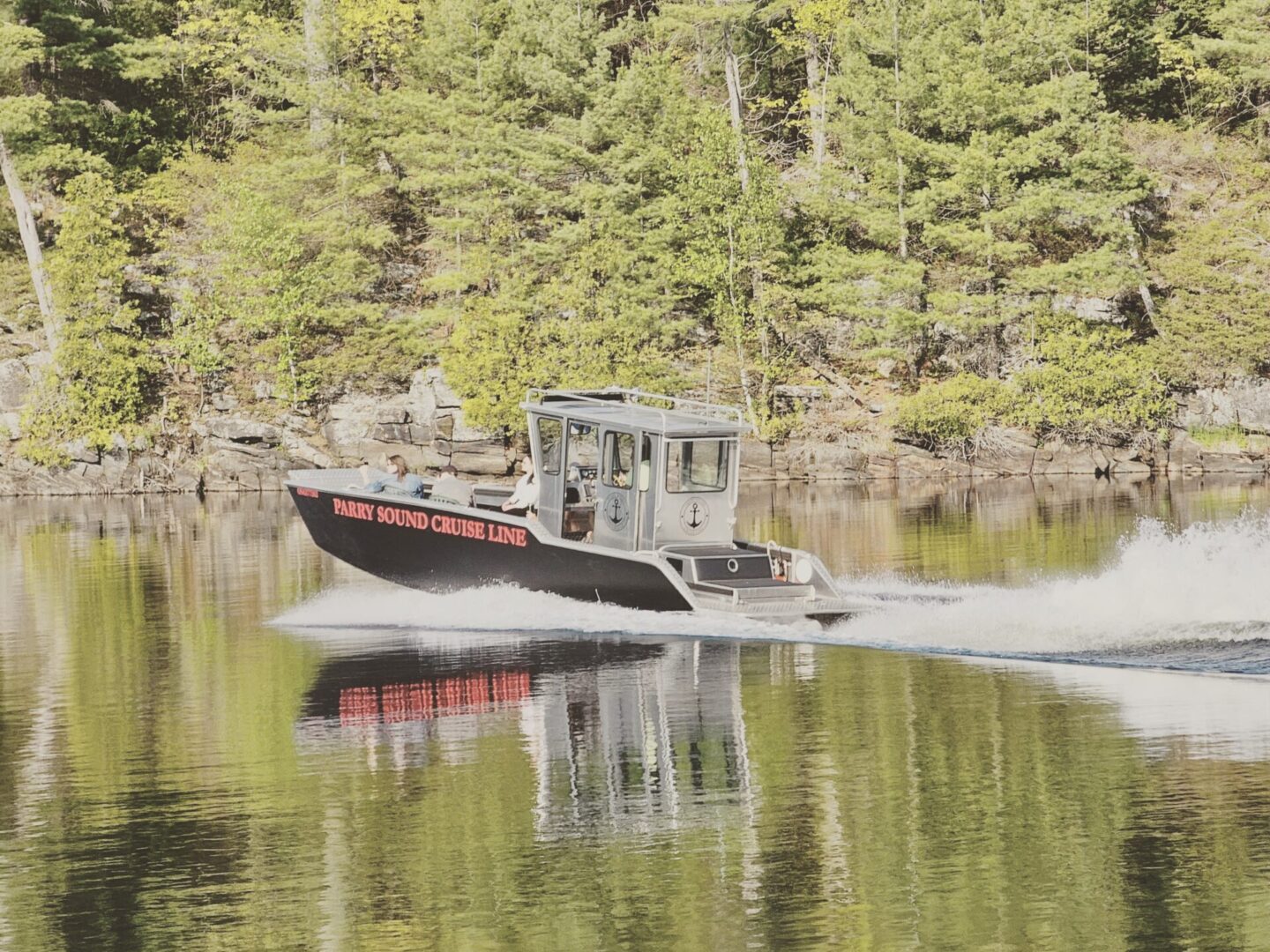 A boat is traveling down the river.